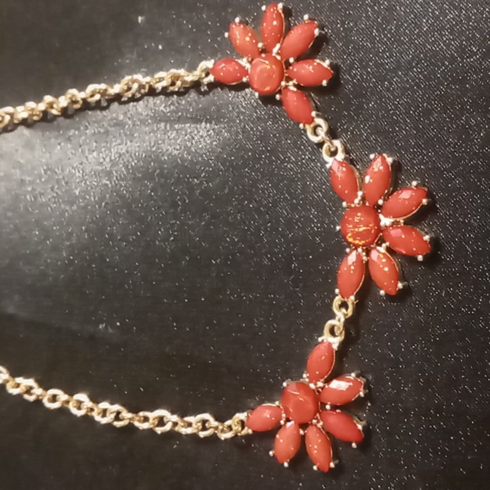 Charming Charlie crimson red flowers in gold finish. 14+3 inches long.